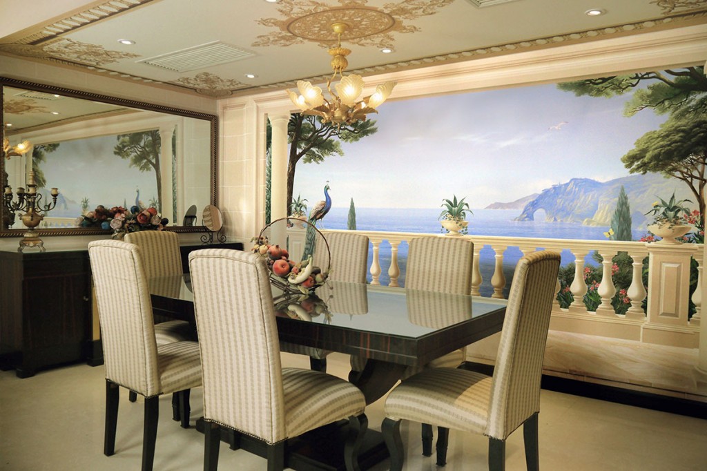 Dining area with a baroque ceiling, illusionistic architecture and a view over the Mediterranean Sea.