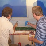 Rainer Maria Latzke and an assistant while painting a dome in a villa in Utah, USA